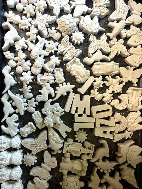 Assorted paintable dinosaurs, butterflies, letters, cars, and animals