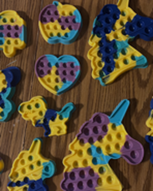 Colorful themed chocolate poppits with dimple details